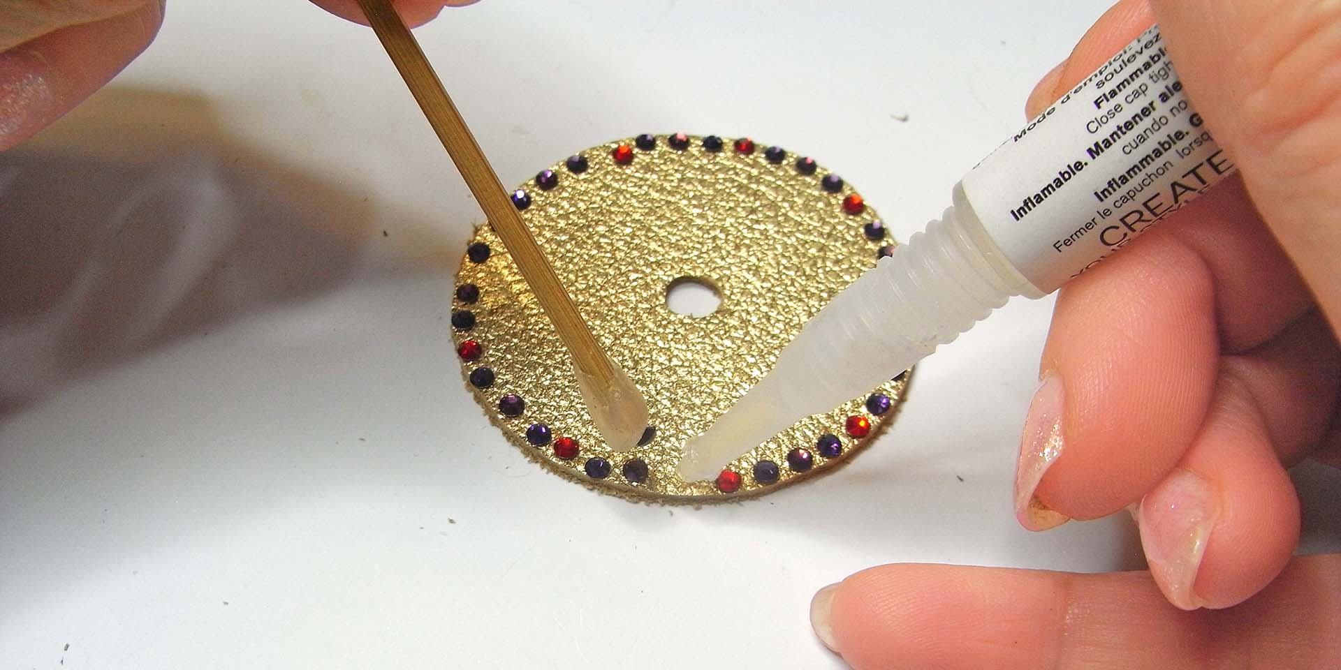 glue the crystals onto the leather