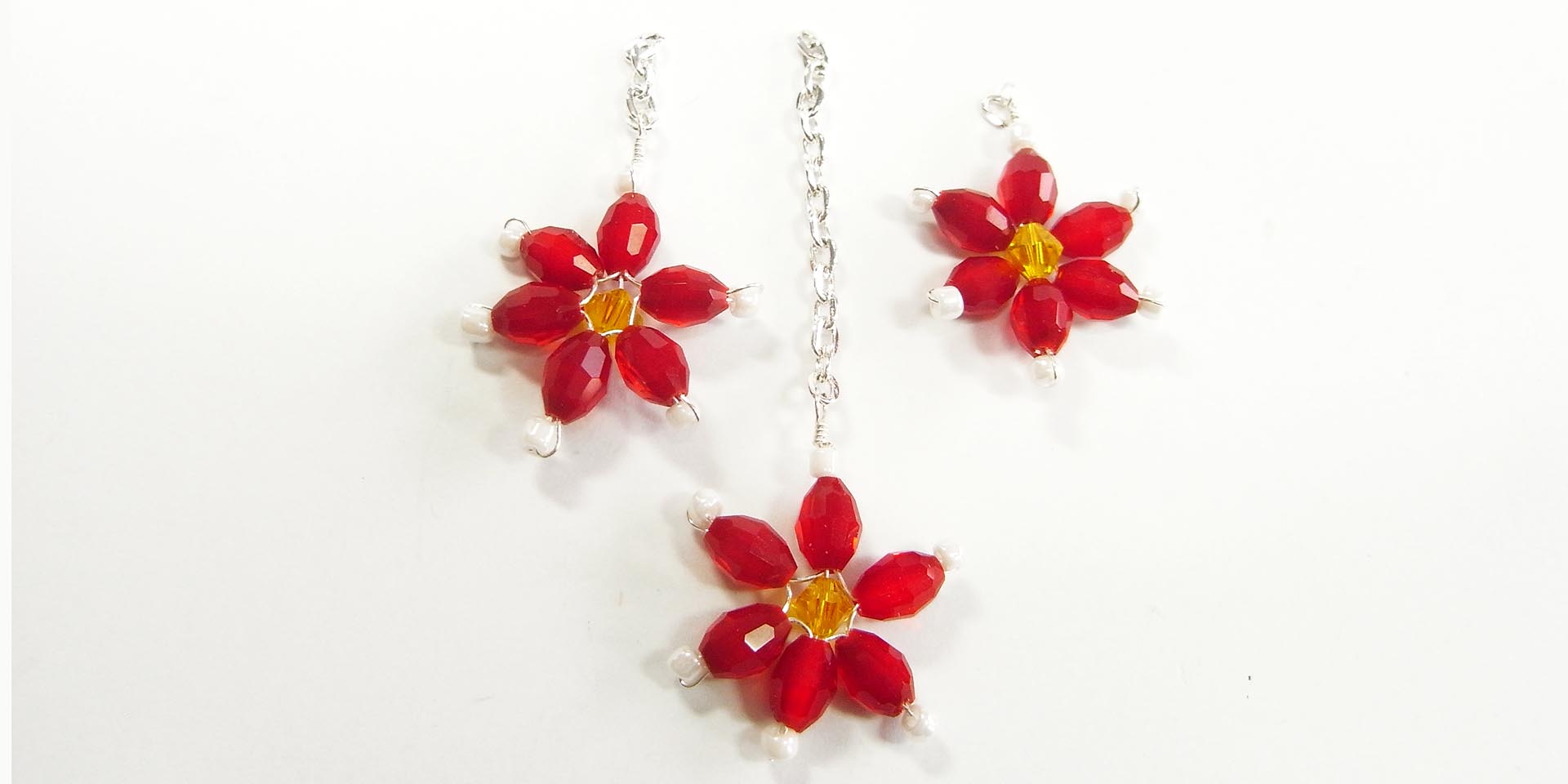 poinsettias on lengths of chain poinsettias on lengths of chain