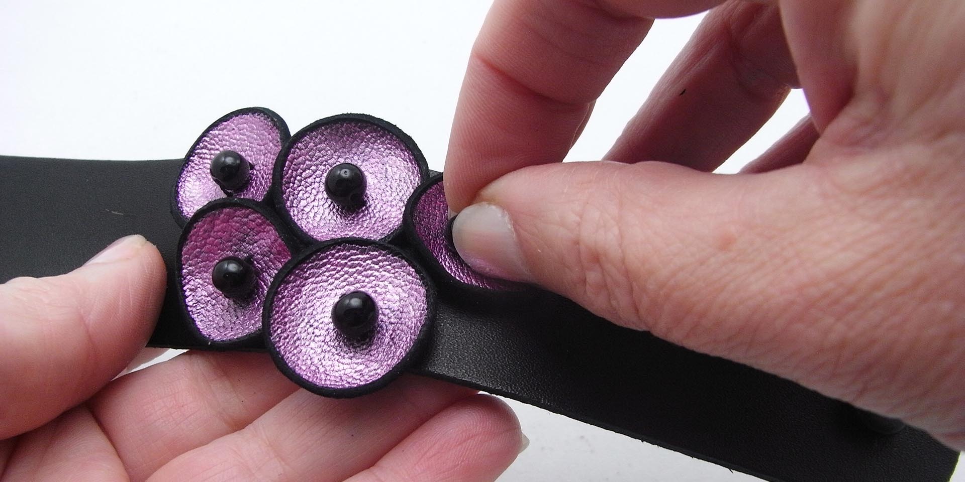 glue leather circles onto leather band glue leather circles onto leather band