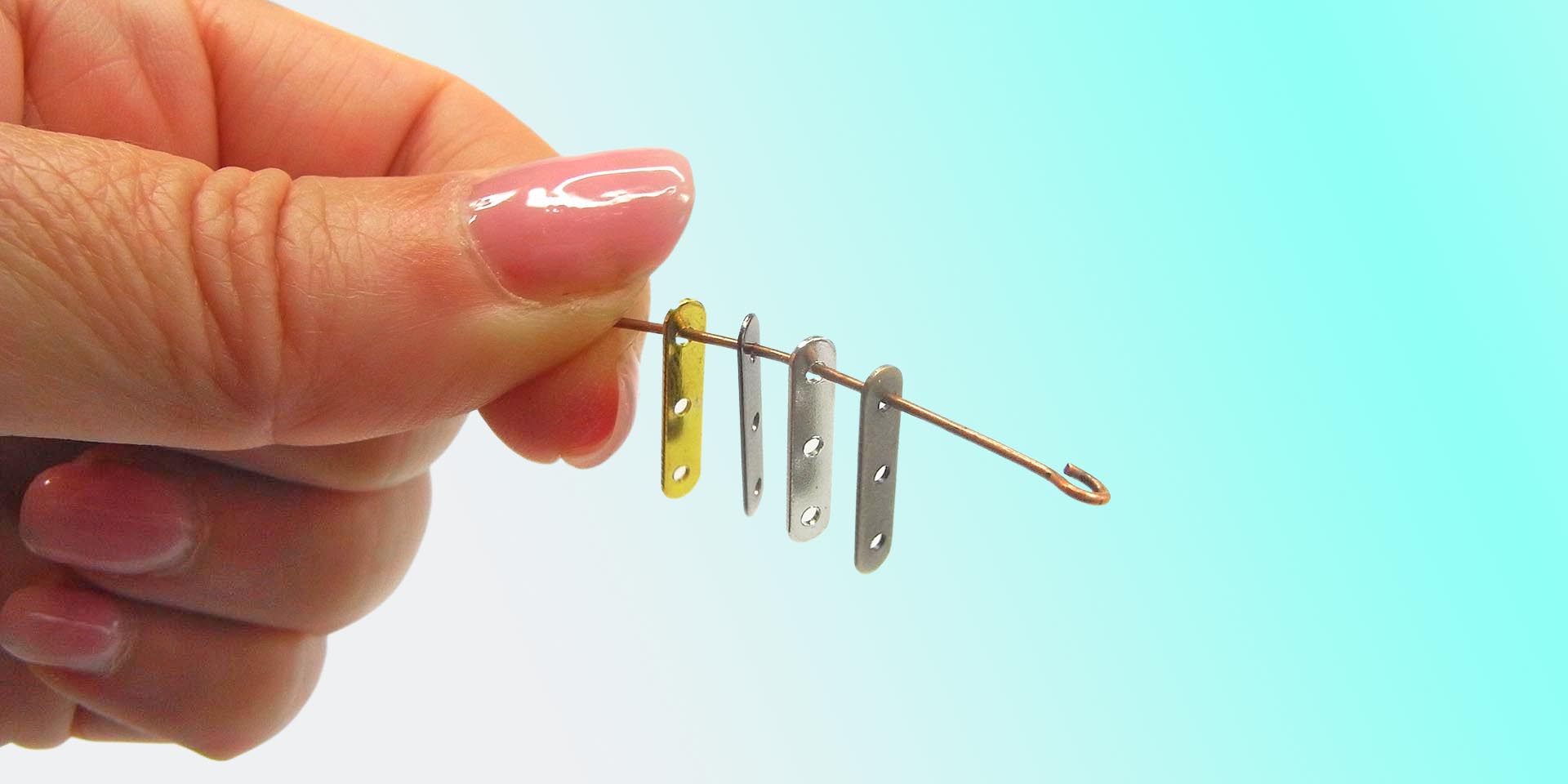 string mixed metal end bars on an eye pin